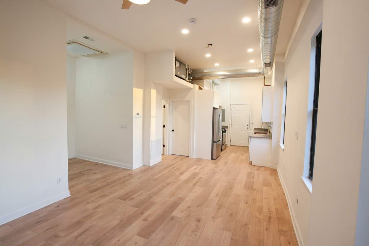 1077 W Polk #2 — living room to kitchen